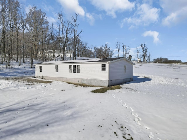 view of snow covered property