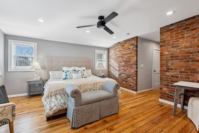 bedroom with ceiling fan and light wood-type flooring