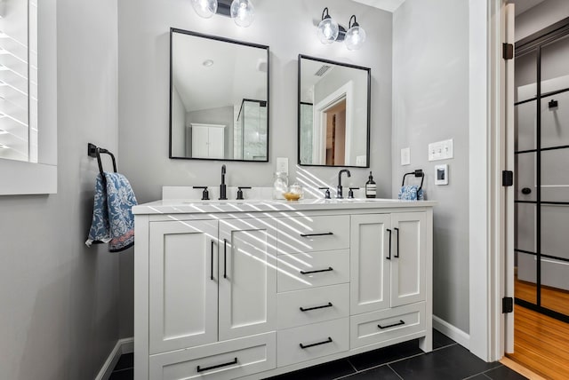 bathroom with vanity and tile patterned floors