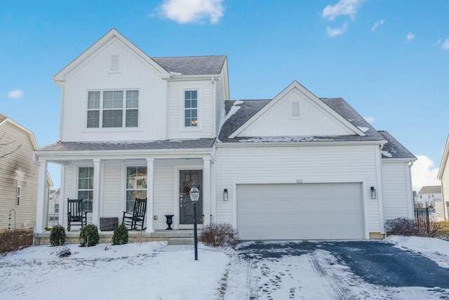 view of front of property with a garage and covered porch