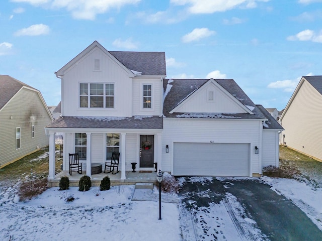 front of property featuring a garage and a porch