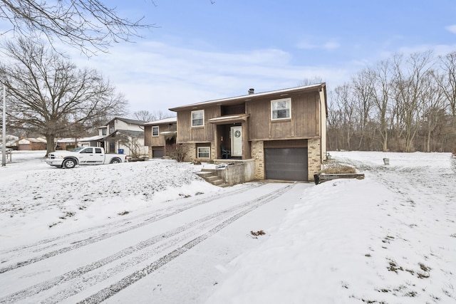 raised ranch featuring a garage