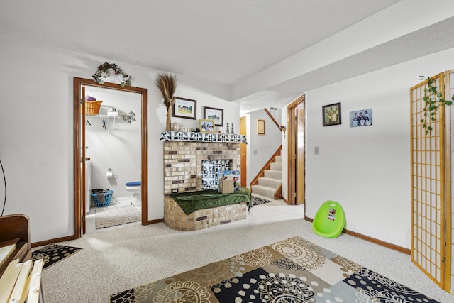 interior space with a textured ceiling and carpet floors