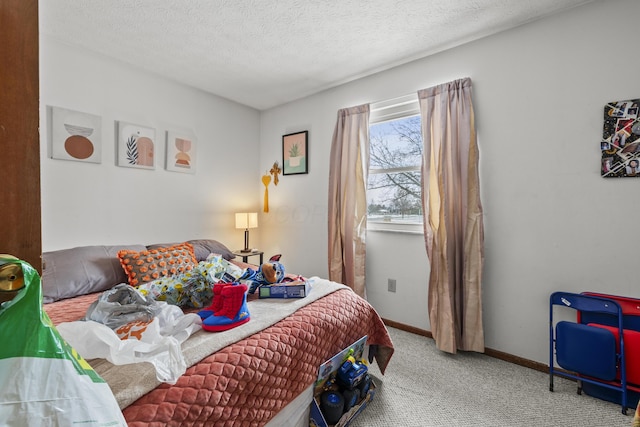 carpeted bedroom with a textured ceiling