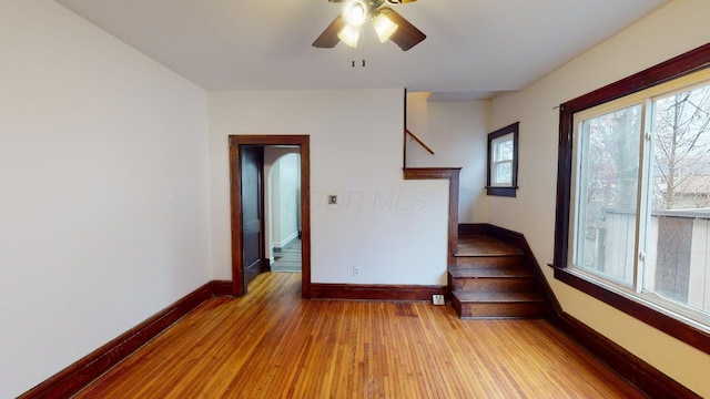 unfurnished room with ceiling fan and light hardwood / wood-style floors