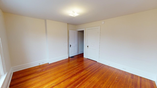 unfurnished room featuring wood-type flooring