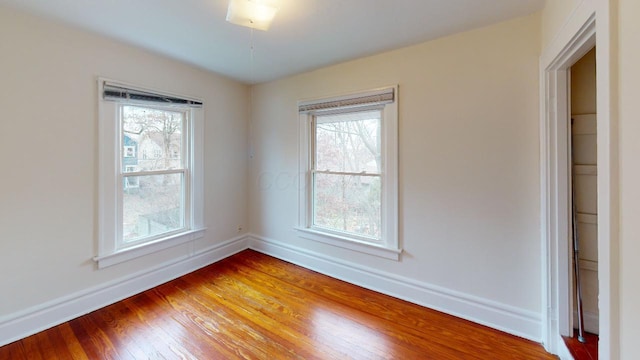 spare room featuring hardwood / wood-style flooring