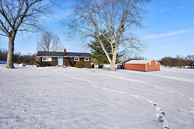 view of yard layered in snow