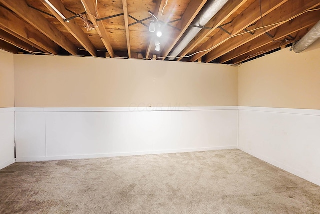 basement with carpet flooring