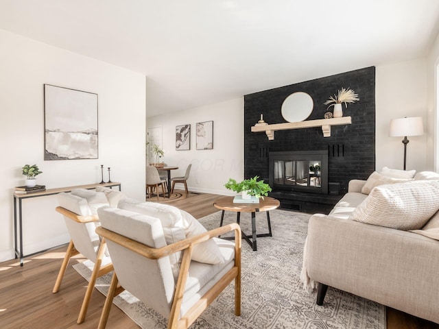 living room featuring hardwood / wood-style flooring and a fireplace