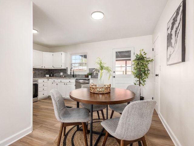 dining space featuring light hardwood / wood-style floors