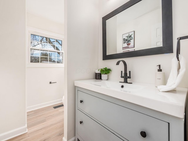 bathroom featuring vanity and hardwood / wood-style floors