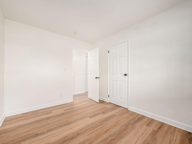 unfurnished room featuring light hardwood / wood-style floors