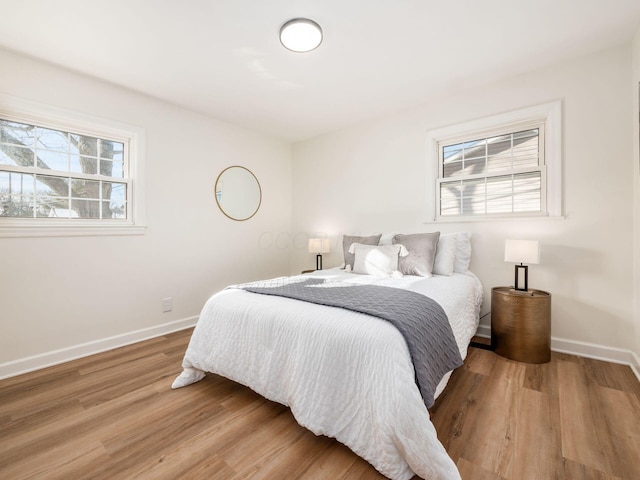 bedroom with hardwood / wood-style flooring