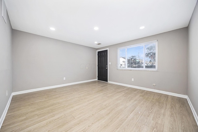 unfurnished room featuring light wood-type flooring