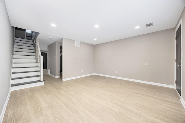 basement featuring light hardwood / wood-style floors