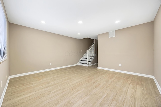 basement featuring light hardwood / wood-style flooring