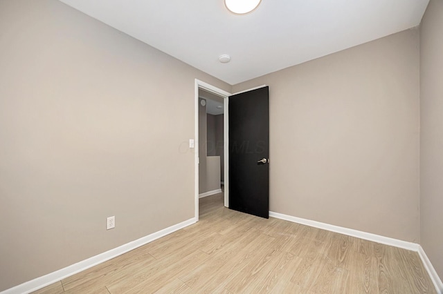 unfurnished room featuring light wood-type flooring