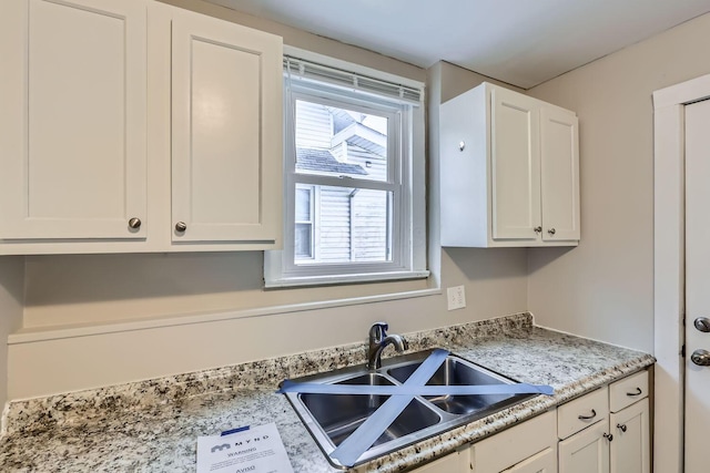 kitchen with sink and white cabinets