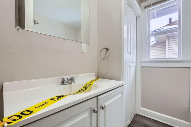 bathroom featuring vanity and hardwood / wood-style floors