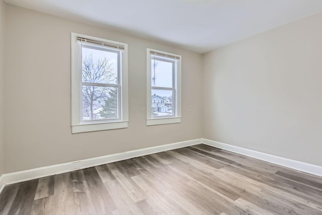 spare room featuring hardwood / wood-style floors