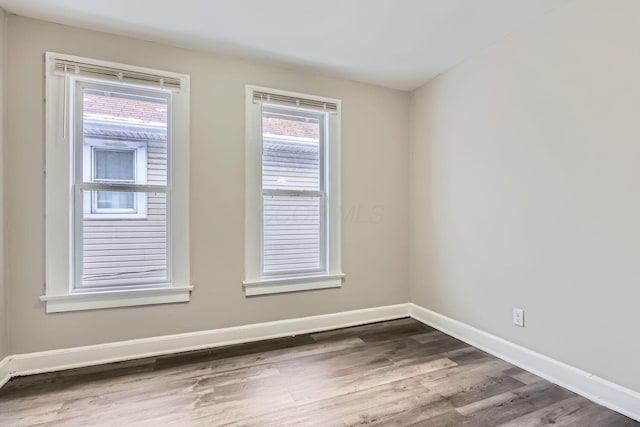 empty room featuring hardwood / wood-style flooring