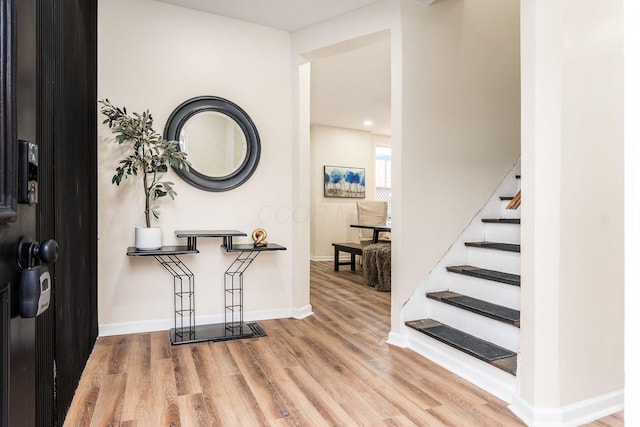 entryway with wood-type flooring