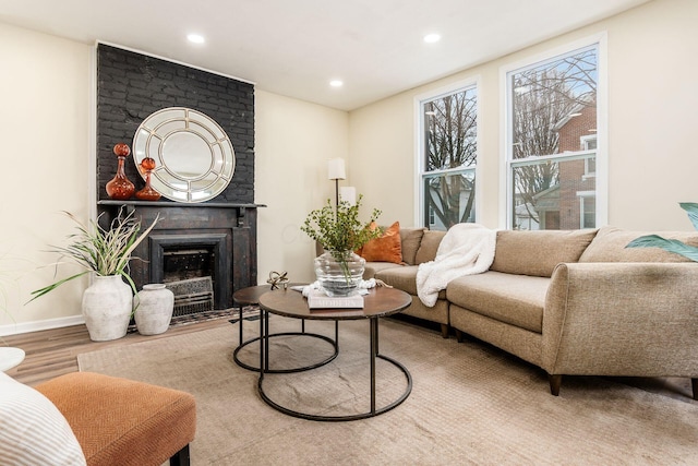 living room featuring a fireplace and hardwood / wood-style floors