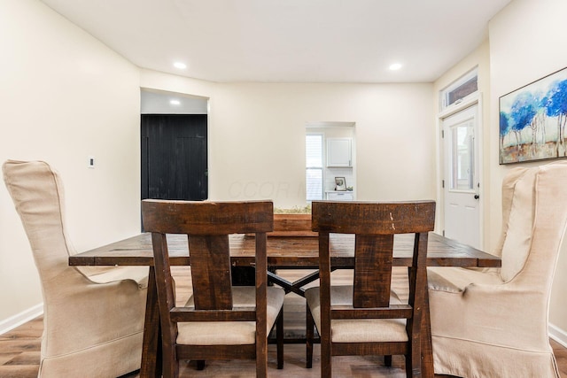 dining area featuring wood-type flooring