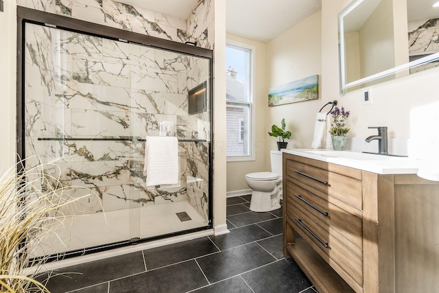 bathroom featuring a shower with shower door, tile patterned floors, toilet, and vanity