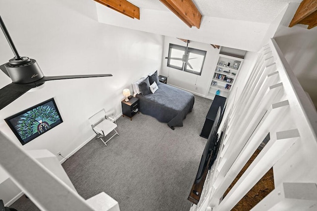 carpeted bedroom featuring lofted ceiling with beams