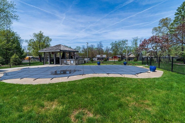 view of pool with a gazebo, a lawn, fence, a patio, and a fenced in pool