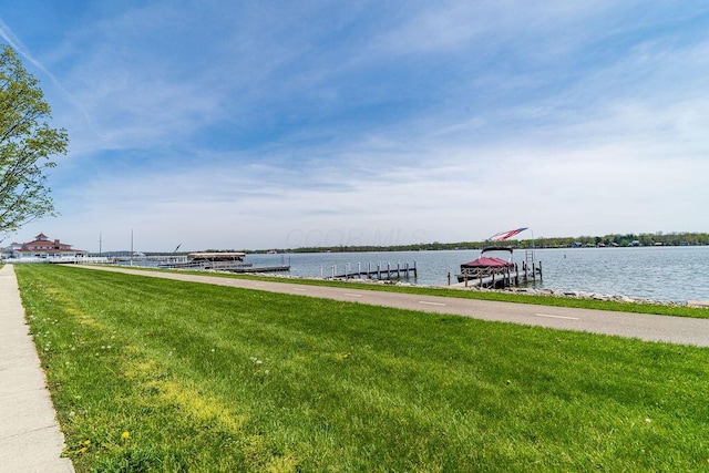 property view of water with a dock