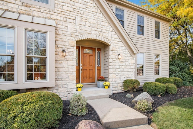 view of exterior entry with stone siding