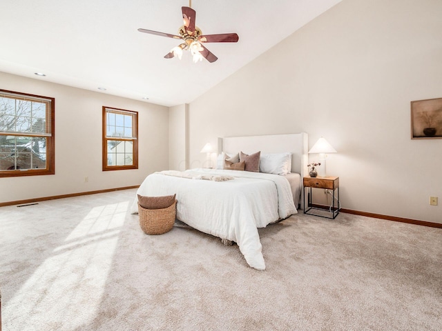 bedroom with baseboards, ceiling fan, visible vents, and light colored carpet