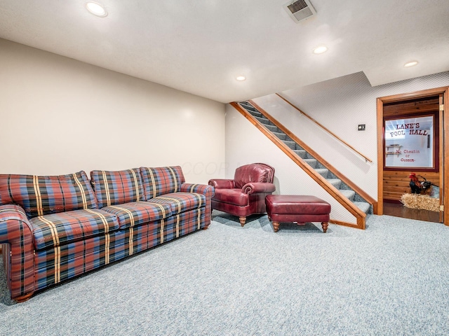 carpeted living room with recessed lighting, visible vents, and stairway