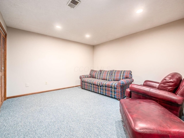 living area featuring recessed lighting, carpet, visible vents, and baseboards