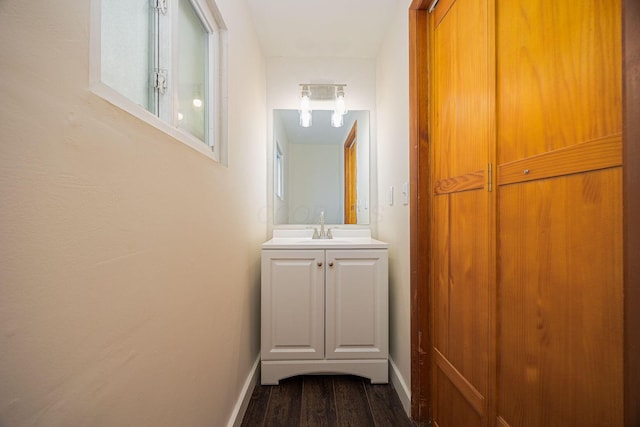 hall featuring sink and wood-type flooring