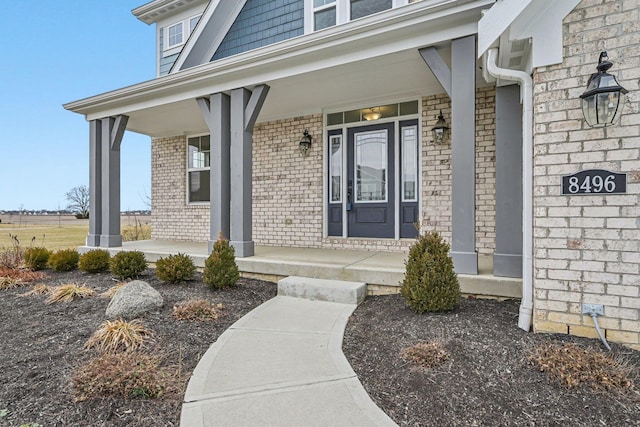 doorway to property featuring covered porch