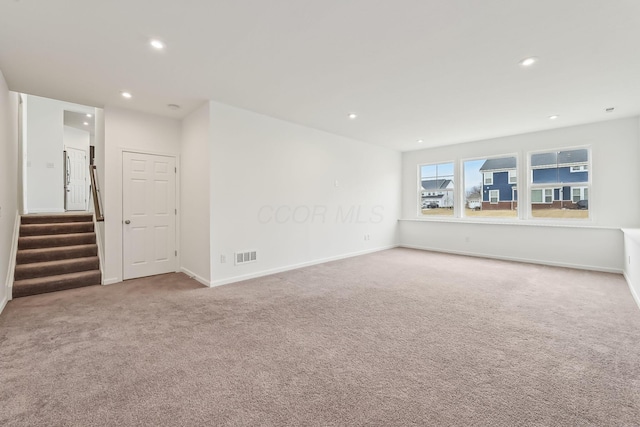 unfurnished living room with carpet