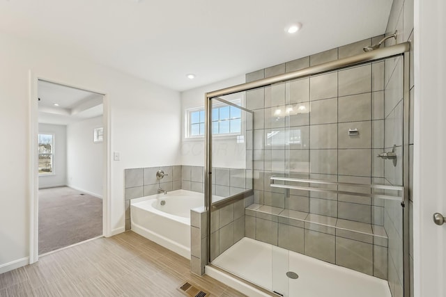 bathroom featuring plus walk in shower