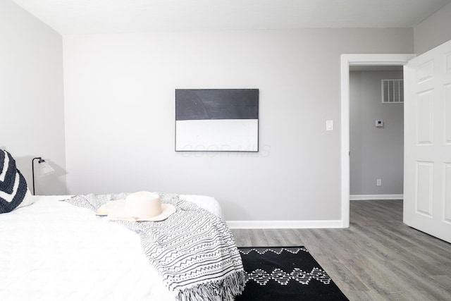 bedroom featuring hardwood / wood-style floors