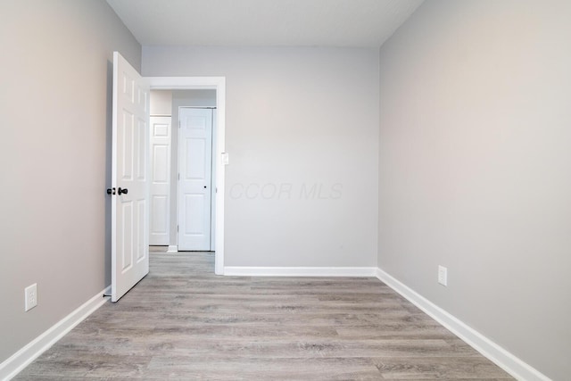 spare room featuring light hardwood / wood-style floors