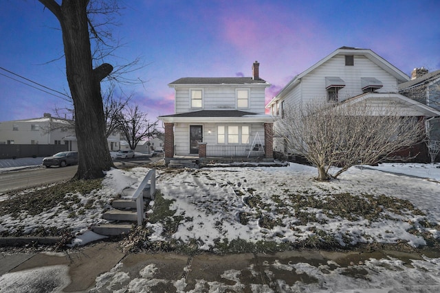 view of front property with covered porch