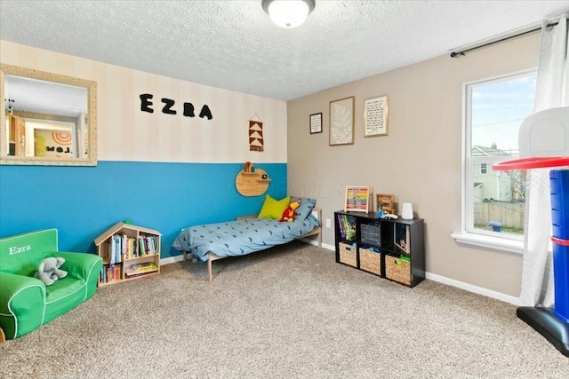 bedroom featuring carpet and a textured ceiling