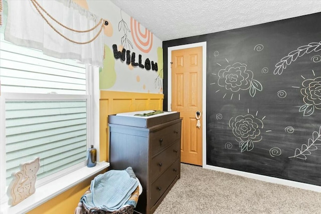 interior space with a textured ceiling and light carpet