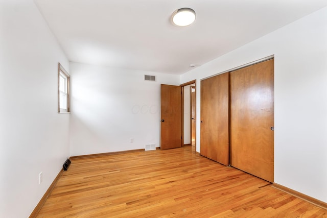 5281 Solomon Ave, Groveport, OH 43125 - unfurnished bedroom featuring light hardwood / wood-style floors and a closet