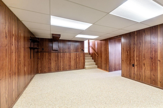 5281 Solomon Ave, Groveport, OH 43125 - basement featuring a paneled ceiling, light colored carpet, and wood walls