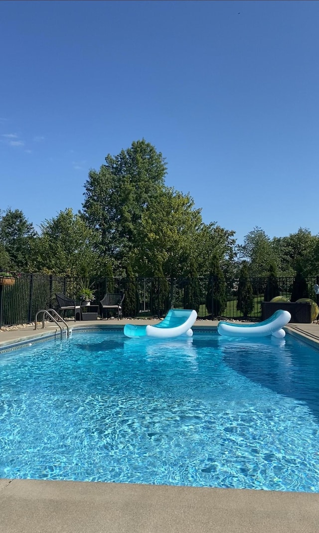 view of swimming pool featuring a water slide