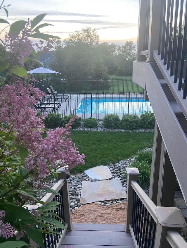 view of yard with a fenced in pool